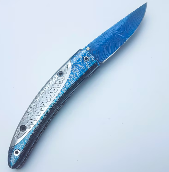 Handmade Folding Knife | Blue Titanium Damascus Blade | Hand-Carved Silver Handle |Box & Leather Sheath - Image 3